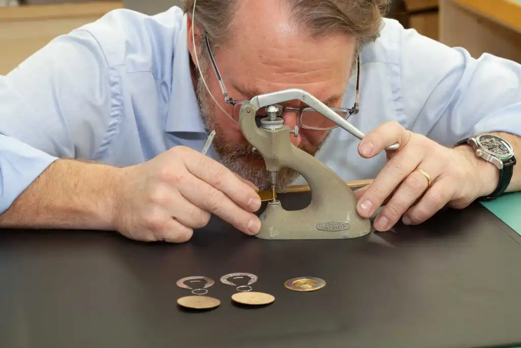 Riviting dial feet in the Garrick workshop