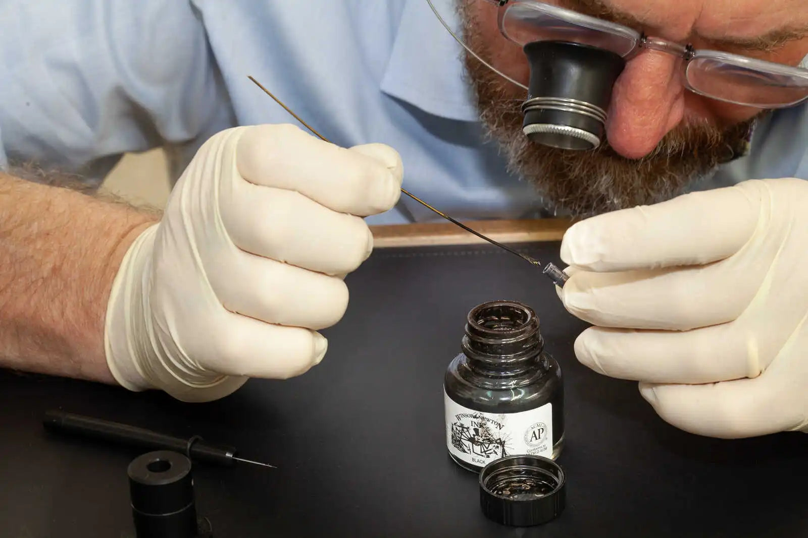 Syringe use for unfilling numerals on a Garrick watch dial