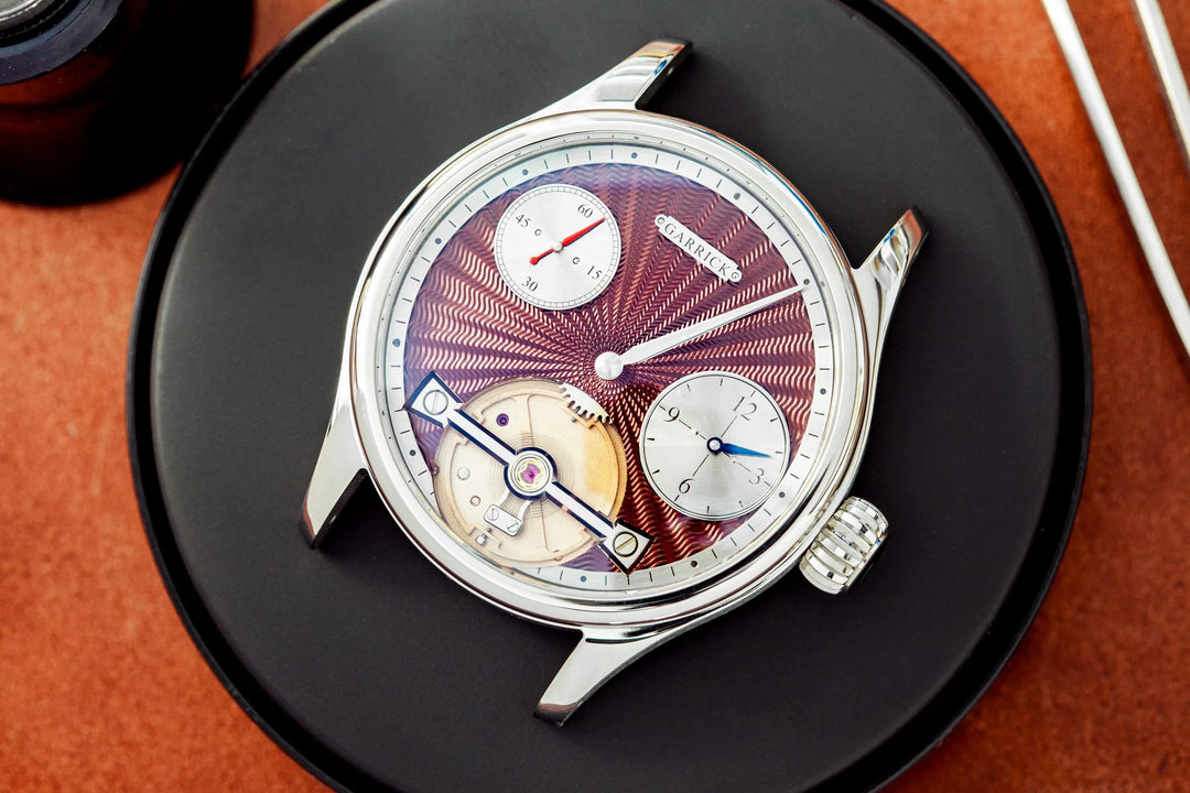British Regulator watch with red engine turned dial and in-house watch movement by Garrick Watchmakers